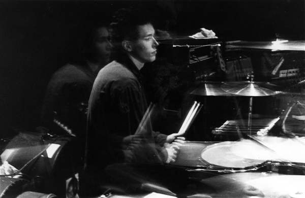 A young Peter playing the drums